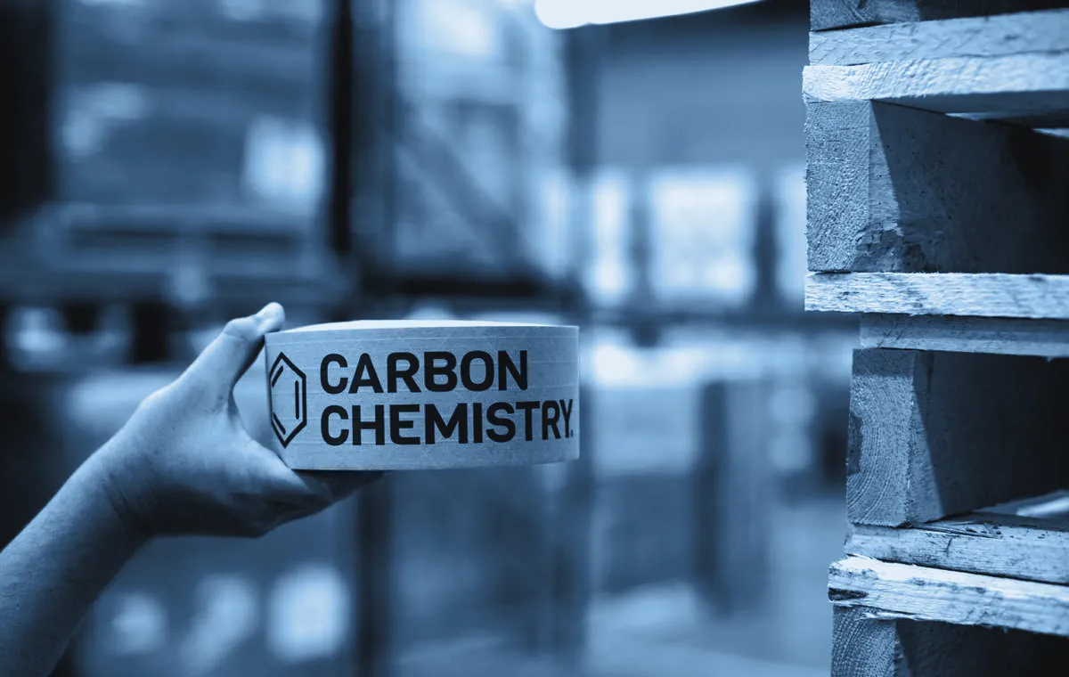 A roll of Carbon Chemistry tape held up on the floor